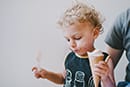 baby boy holding ice cream