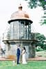 Bride and Groom in front of lighthouse
