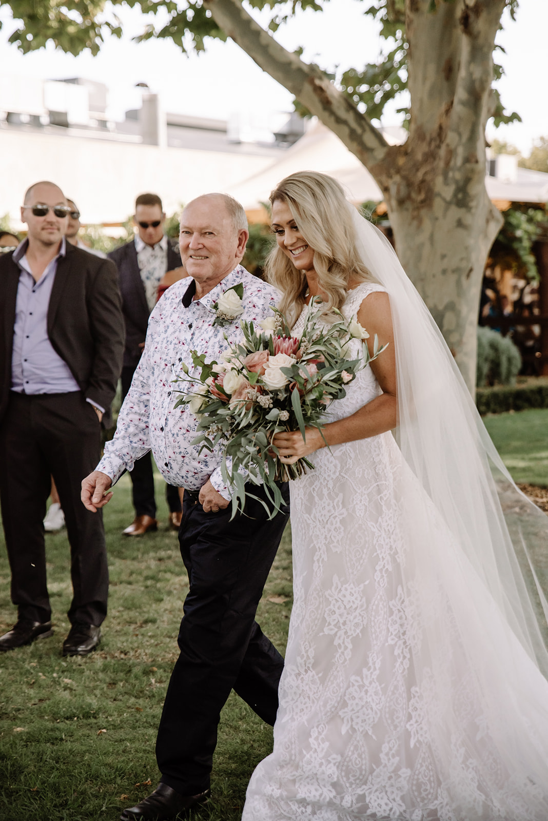 sandalford wedding photographer bride walking down aisle at sandalford
