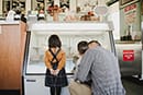 dad buying ice cream for daughter and son