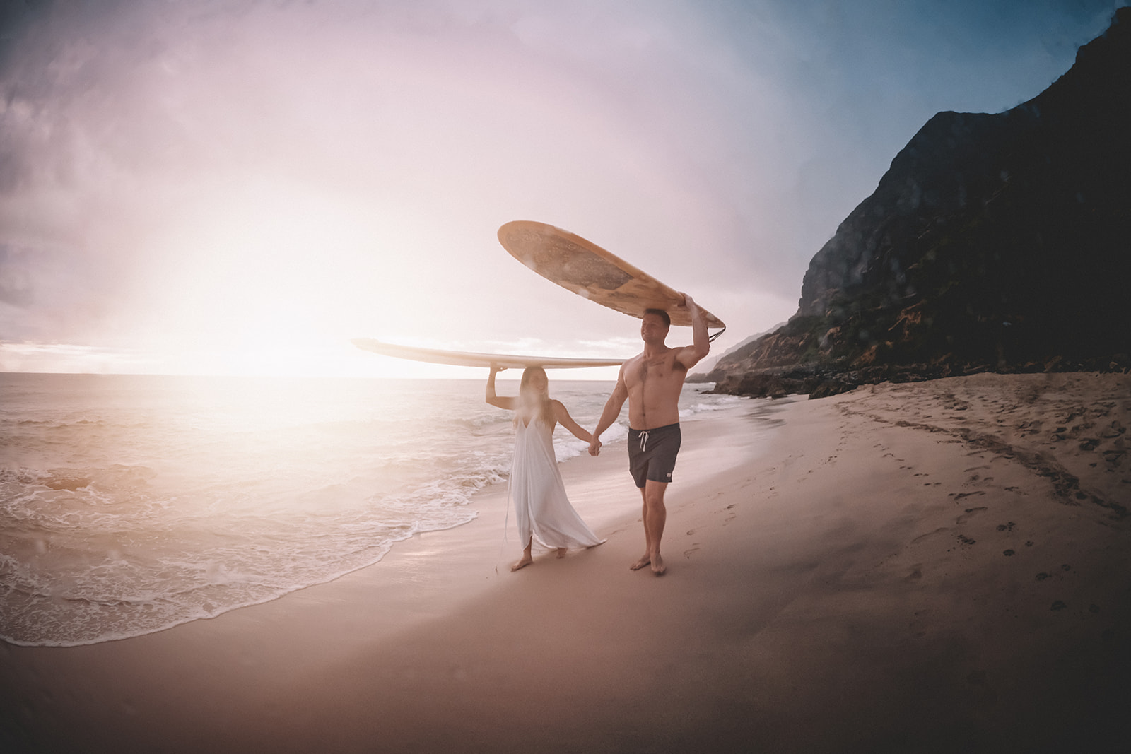 Underwater Couples Engagement Surfboard photos at Makua Beach on Oahu, Hawaii