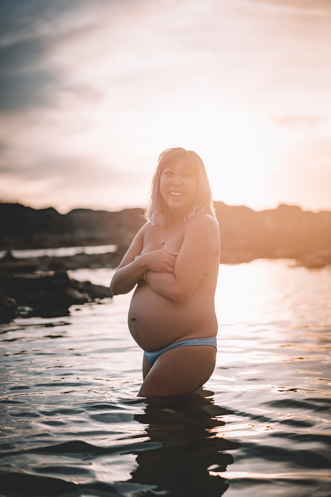 Babymoon photos in Hawaii Underwater Maternity Photos at Sharks Cove on Oahu
