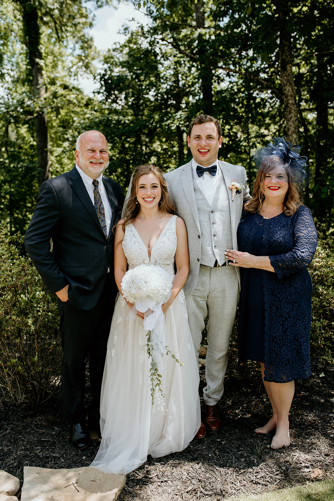 bride and groom with grooms parents