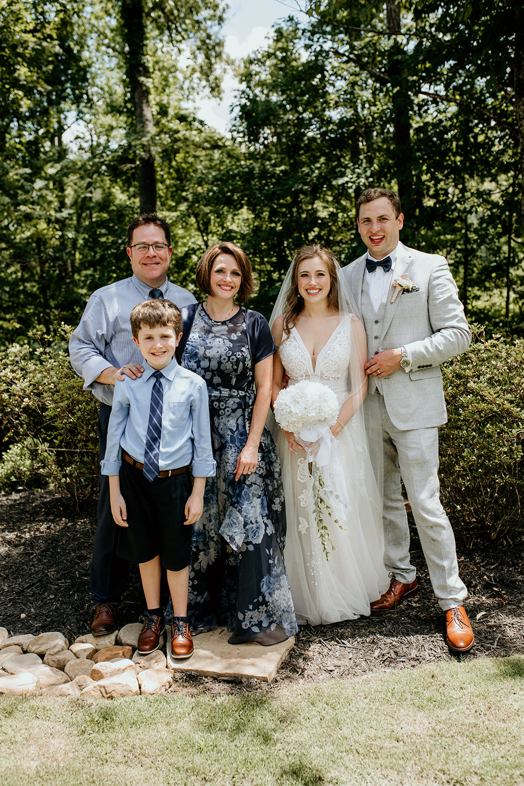 bride and groom with mother, step father and brother