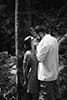 Black and white photo of couple in Oahu forest