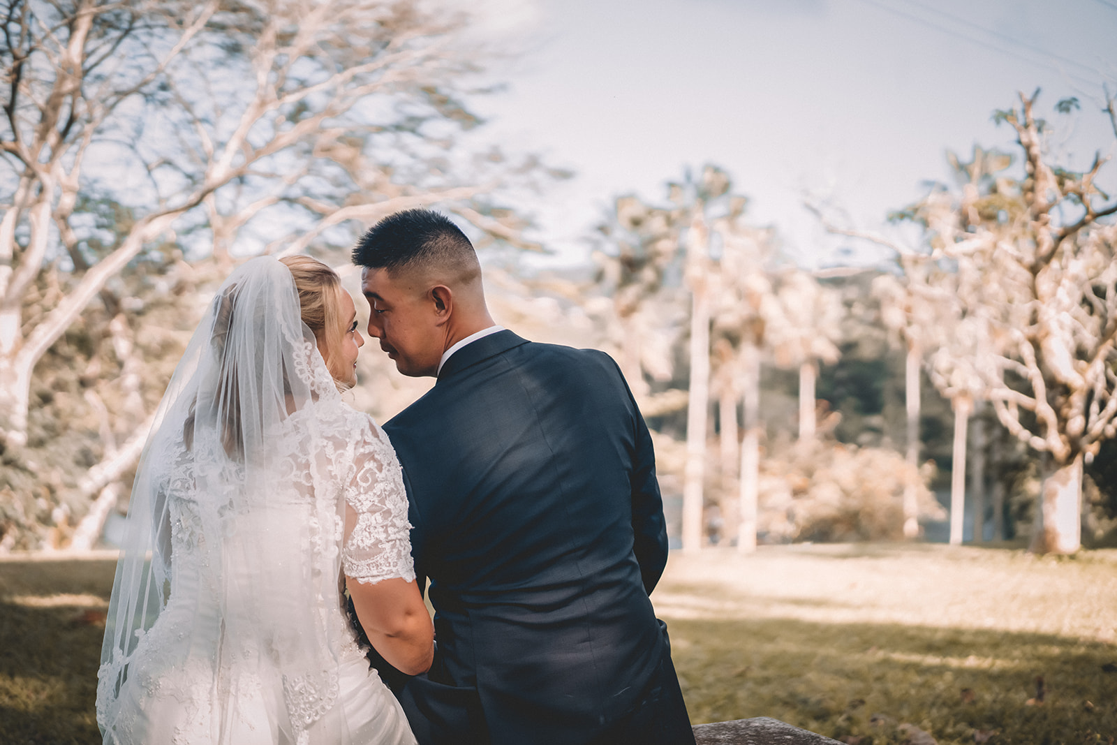 Couple looking into each others eyes hoomaluhia botanical garden