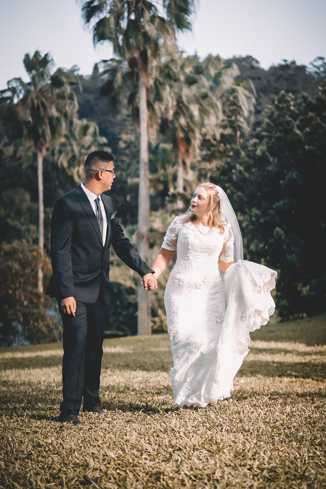 Couple walking and talking hoomaluhia botanical garden