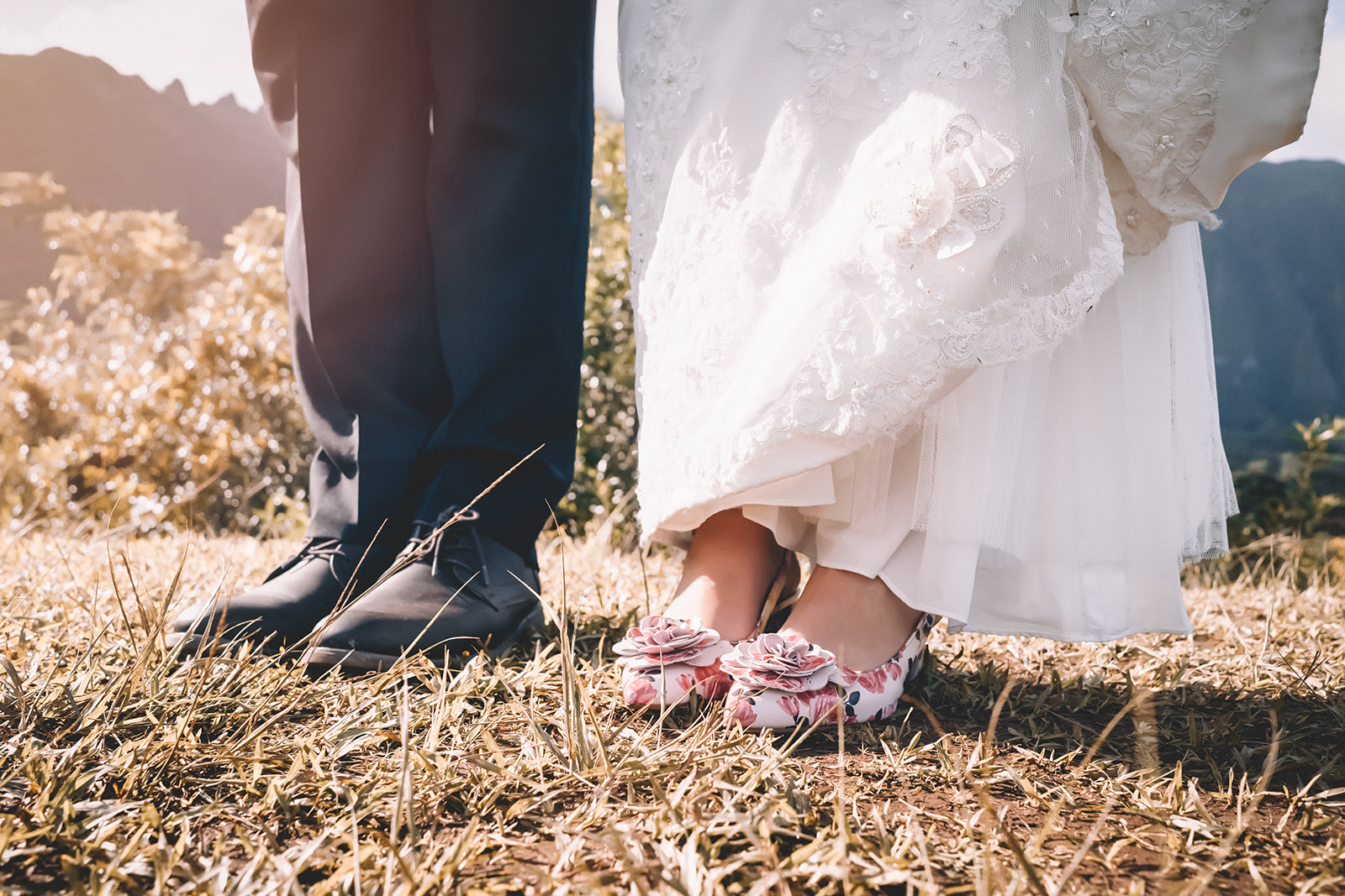 bride and groom standing in hoomaluhia botanical garden