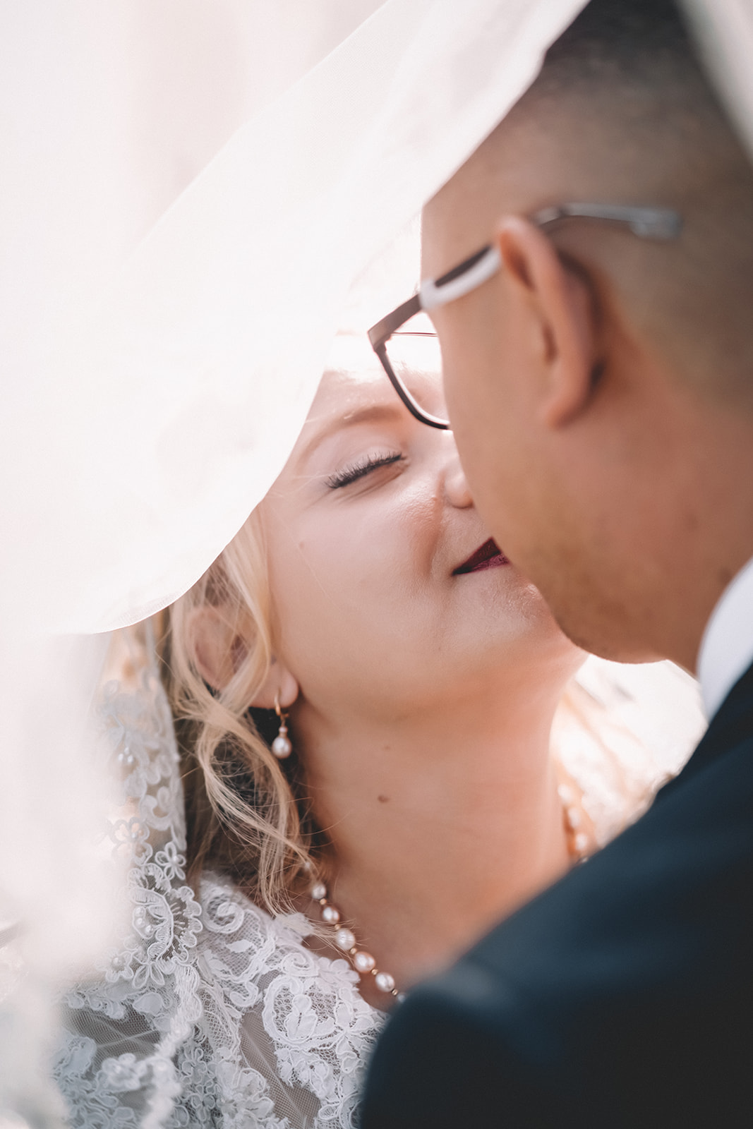bride eyes closed kiss groom