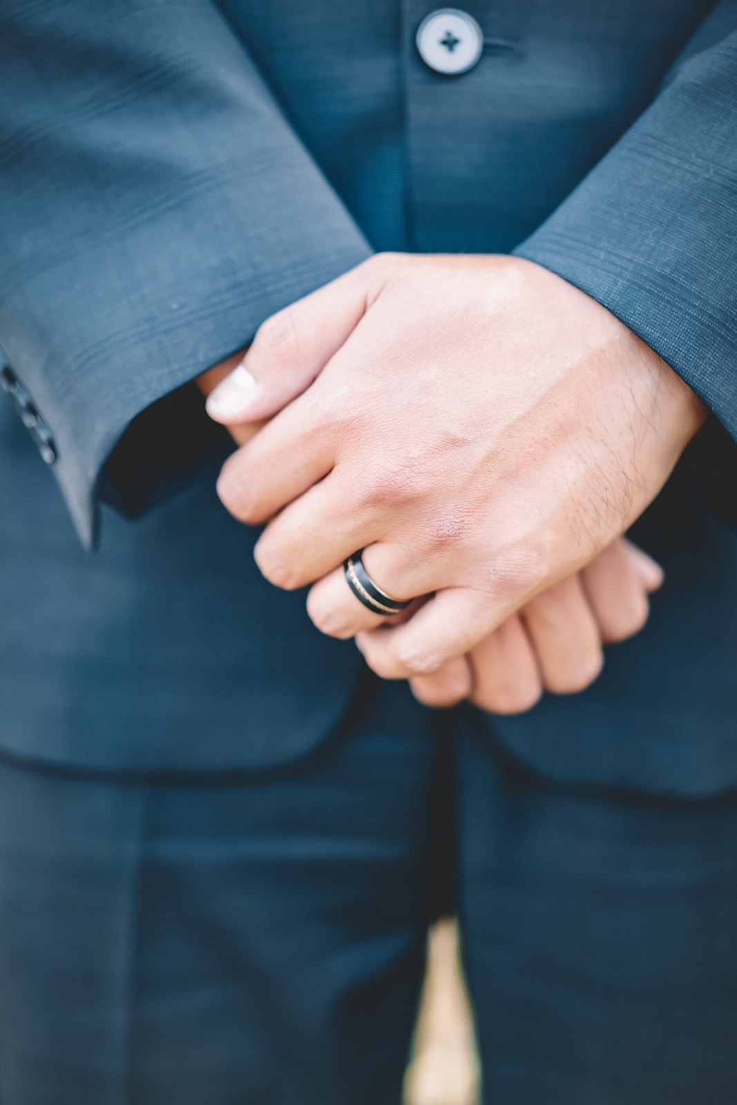 groom blue suit wedding band