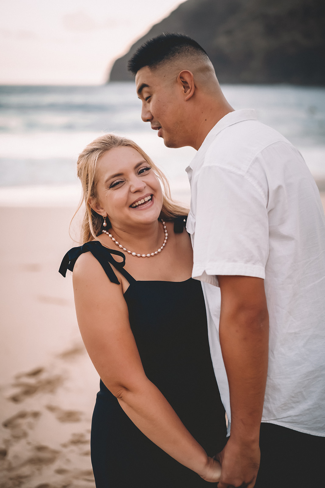 man and woman smiling laughing makapuu beach