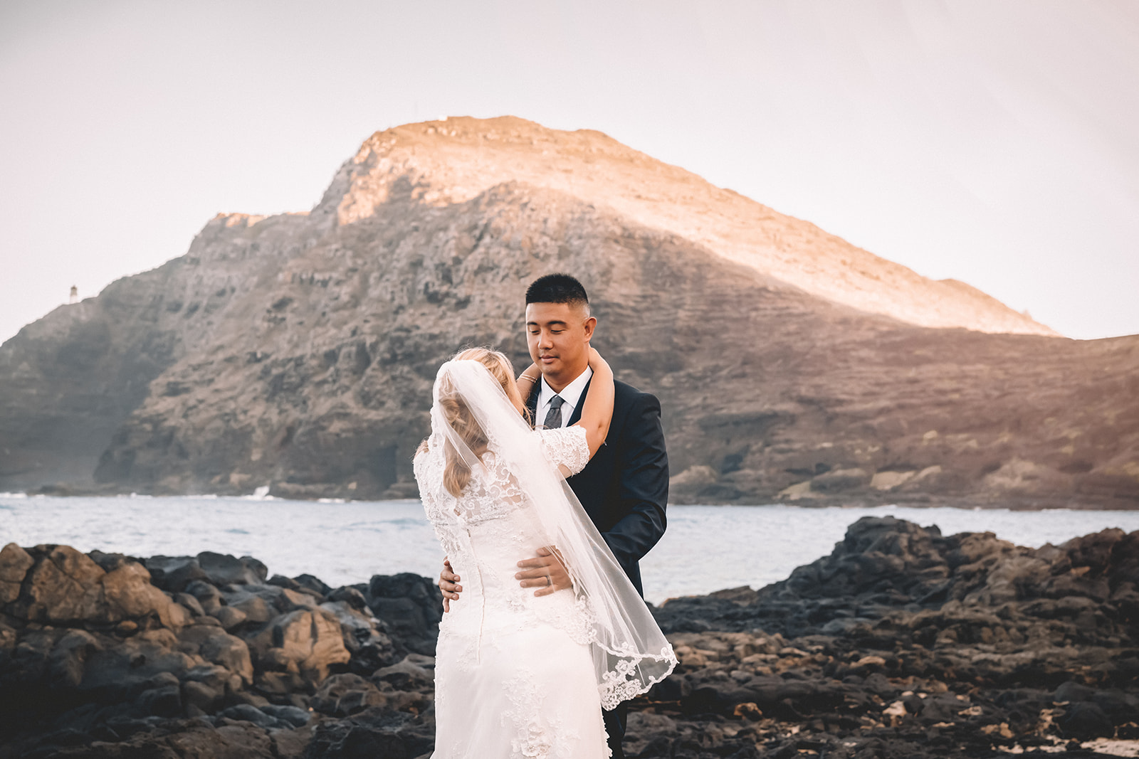 man and woman holding each other dancing makapuu beach