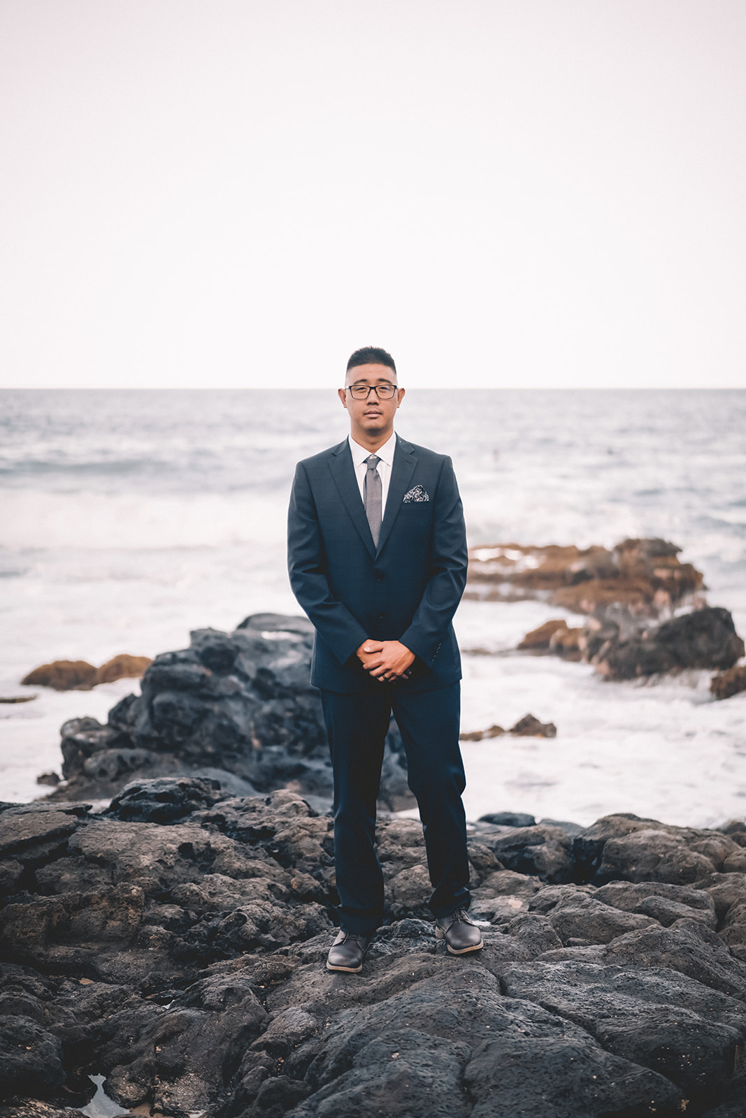 groom makapuu beach hawaii engagement