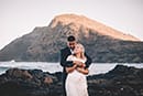 husband and wife holding eachother Makapuu beach