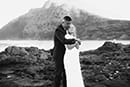 black and white photo bride and groom hugging makapuu beach