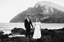 Black and white photo couple holding hands makapuu beach hawaii