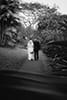 bride and groom walking into distance hoomaluhia botanical garden