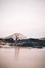 man and woman standing on rocks makapuu beach holding hands