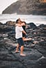 man holding and kissing woman makapuu beach