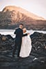 bride and groom dancing makapuu beach rocks