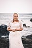 bride standing on rocks makapuu beach hawaii