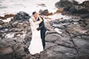 hawaii engagement couple kissing rocks makapuu beach