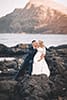 engaged couple Hawaii kissing on rock wall Makapuu beach 